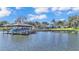 Home with dock and boat shelter on calm lake at 809 Fairlane Dr, Lakeland, FL 33809