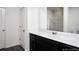 Bathroom boasts a double vanity with dark wood cabinets at 3527 Fernanda Dr, Deltona, FL 32738