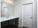Bathroom features a single vanity and a large mirror at 3527 Fernanda Dr, Deltona, FL 32738