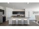 Modern kitchen with island, stainless steel appliances, and granite countertops at 3527 Fernanda Dr, Deltona, FL 32738