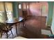 Dining room features hardwood floors and an arched entryway at 142 Park Blvd, New Smyrna Beach, FL 32168