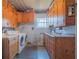 Functional laundry room with washer, dryer, and ample cabinets at 2200 S Peninsula Dr, Daytona Beach, FL 32118
