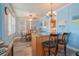 Charming dining area with wood table and chairs, and kitchen island at 2200 S Peninsula Dr, Daytona Beach, FL 32118