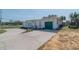 Ranch-style home with green garage door at 2200 S Peninsula Dr, Daytona Beach, FL 32118