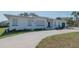 Ranch-style home with green garage door at 2200 S Peninsula Dr, Daytona Beach, FL 32118