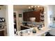 Kitchen features a long countertop and wooden cabinets at 607 N Dixie Fwy, New Smyrna Beach, FL 32168