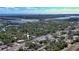 Aerial view showing home's location in a residential area near the coast at 607 N Dixie Fwy, New Smyrna Beach, FL 32168