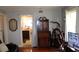 Living room with hardwood floors, wooden furniture, and a TV at 607 N Dixie Fwy, New Smyrna Beach, FL 32168