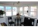Cozy breakfast nook with a small table and four chairs at 607 N Dixie Fwy, New Smyrna Beach, FL 32168