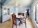 Dining area with round table and chairs, white brick wall at 603 N Pine St, New Smyrna Beach, FL 32169