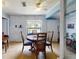Charming dining area with round table and four chairs, white brick accent wall at 603 N Pine St, New Smyrna Beach, FL 32169