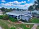 Charming single story home with a covered patio and lush landscaping at 603 N Pine St, New Smyrna Beach, FL 32169
