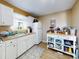 Bright kitchen with white cabinets and wood counter tops at 603 N Pine St, New Smyrna Beach, FL 32169