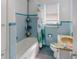 Clean bathroom with a tub, shower, and updated vanity at 603 N Pine St, New Smyrna Beach, FL 32169