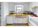 Efficient kitchen, white cabinets, wood countertops at 603 N Pine St, New Smyrna Beach, FL 32169
