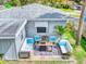 Relaxing patio with comfortable seating and fire pit at 603 N Pine St, New Smyrna Beach, FL 32169