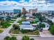Single story home with ocean views, a covered patio, and lush landscaping at 603 N Pine St, New Smyrna Beach, FL 32169