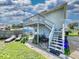Elevated deck with stairs leading to the yard at 603 N Pine St, New Smyrna Beach, FL 32169