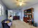 Spacious bedroom with built-in shelving and a comfy chair at 603 N Pine St, New Smyrna Beach, FL 32169