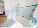 Bathroom with a shower/tub and tiled walls at 603 N Pine St, New Smyrna Beach, FL 32169
