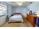Bedroom with double bed, dresser, and window with curtains at 603 N Pine St, New Smyrna Beach, FL 32169