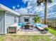Relaxing patio area furnished with comfy seating at 603 N Pine St, New Smyrna Beach, FL 32169
