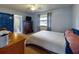 Bedroom with a double bed, dresser, and ensuite bathroom at 603 N Pine St, New Smyrna Beach, FL 32169