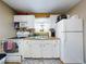 Clean and efficient kitchen with white cabinetry at 603 N Pine St, New Smyrna Beach, FL 32169
