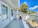 Private deck with seating and street view at 603 N Pine St, New Smyrna Beach, FL 32169