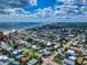Aerial view of a residential area near the beach, showcasing houses and streets at 603 N Pine St, New Smyrna Beach, FL 32169