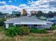 Single story home with a covered patio, great curb appeal, and ocean views at 603 N Pine St, New Smyrna Beach, FL 32169