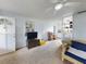 Cozy living room featuring wicker furniture and built-in shelves at 603 N Pine St, New Smyrna Beach, FL 32169