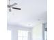 High ceiling living room with chandelier and ceiling fan at 243 Lagoon Mist Ct, Oak Hill, FL 32759