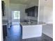Kitchen island with double sink and breakfast bar at 243 Lagoon Mist Ct, Oak Hill, FL 32759