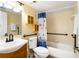 Bathroom with tub, shower, and wood vanity at 4139 S. Atlantic Ave # B504, New Smyrna Beach, FL 32169