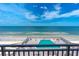 Ocean view from condo balcony with pool in foreground at 4139 S. Atlantic Ave # B504, New Smyrna Beach, FL 32169