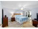 Relaxing bedroom with ocean-themed bedding and ensuite bath at 4139 S. Atlantic Ave # B504, New Smyrna Beach, FL 32169