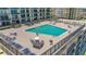 Condo rooftop pool with plenty of lounge chairs at 4139 S. Atlantic Ave # B504, New Smyrna Beach, FL 32169