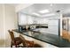 Kitchen with granite countertops and white cabinets at 4139 S. Atlantic Ave # B504, New Smyrna Beach, FL 32169