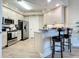 Modern kitchen with stainless steel appliances and breakfast bar at 1 Riverwalk Dr # 302, New Smyrna Beach, FL 32169