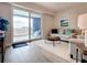 Living room with sliding glass doors leading to balcony at 1 Riverwalk Dr # 302, New Smyrna Beach, FL 32169
