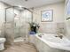 Spa-like bathroom with soaking tub and walk-in shower at 1 Riverwalk Dr # 302, New Smyrna Beach, FL 32169