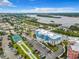Aerial view of waterfront community with tennis court and parking at 1 Riverwalk Dr # 302, New Smyrna Beach, FL 32169