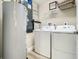 Convenient laundry room with washer and dryer hookups at 1 Riverwalk Dr # 302, New Smyrna Beach, FL 32169
