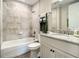 Clean bathroom with granite vanity, tile shower, and bathtub at 1 Riverwalk Dr # 302, New Smyrna Beach, FL 32169