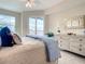 Bright bedroom with sliding door to balcony access at 1 Riverwalk Dr # 302, New Smyrna Beach, FL 32169