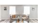 Living room with beige sofa, neutral decor, and wood floors at 1355 Powers Ave, Daytona Beach, FL 32117