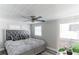 Main bedroom with ceiling fan and plush bed at 1355 Powers Ave, Daytona Beach, FL 32117
