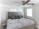 Spacious bedroom with ceiling fan and large bed at 1355 Powers Ave, Daytona Beach, FL 32117
