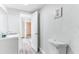 Bathroom with toilet and access to another room at 1355 Powers Ave, Daytona Beach, FL 32117